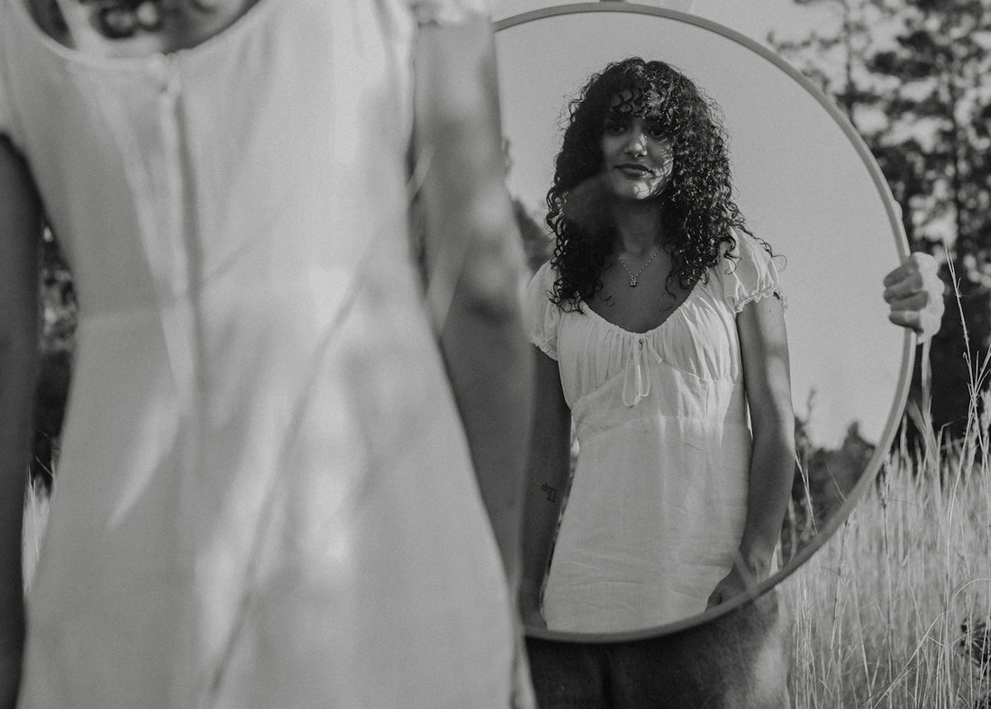 a person holding a white umbrella